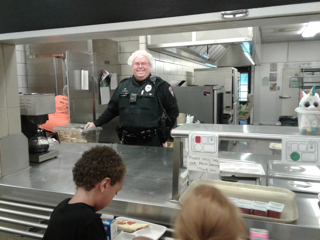 officer serving food at school